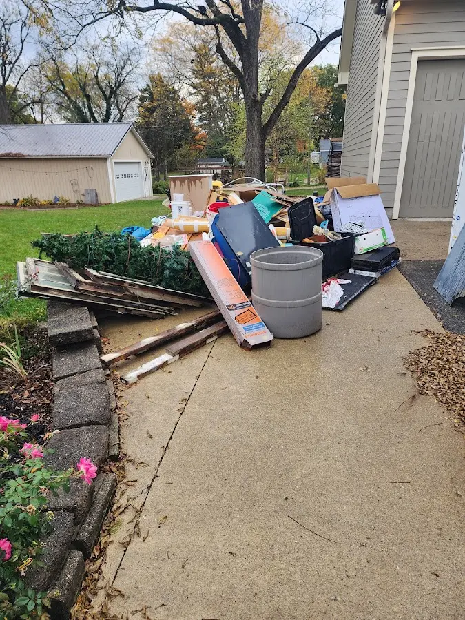 Dumpster being loaded with debris for 3 Yard Dumpster Rental in Saratoga Springs